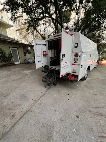 Magnet Plumbing service vehicle on-site for Grease Trap Cleaning in Laguna Heights